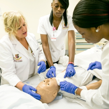 3 Nursing Students Working on Dummy