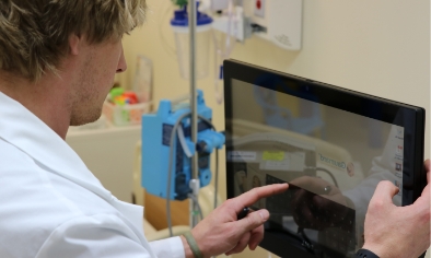 A nursing student uses state-of-the-art technology in a Jersey College classroom.