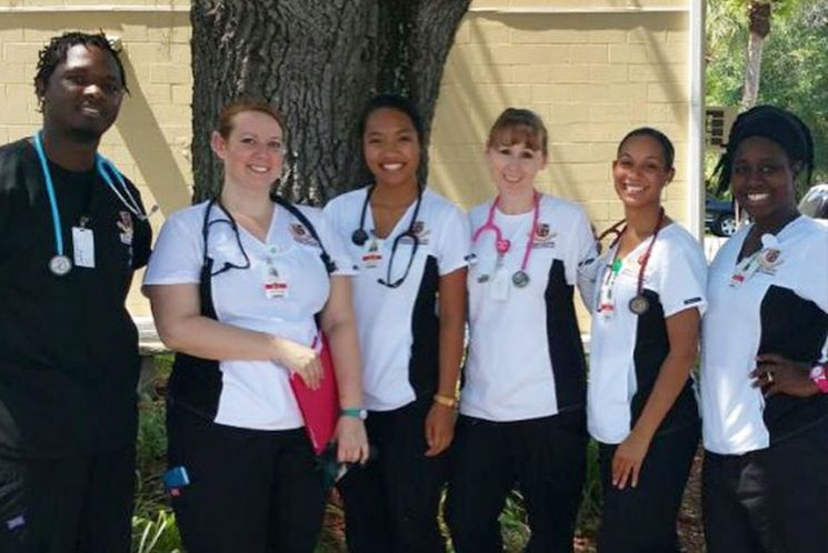 Nursing students pose during clinicals