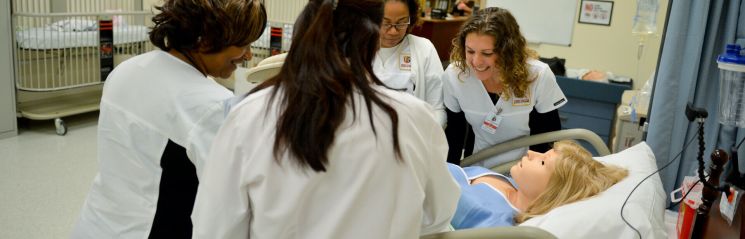 Nursing students at Jersey College practice techniques in the simulation lab.